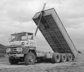 NSTH Rhino with a tag -axle tipper stockpiling aggregate somewhere in Southland. This was quite a commen configuration at a time as heavier combinations were put to work in the late 1970s.